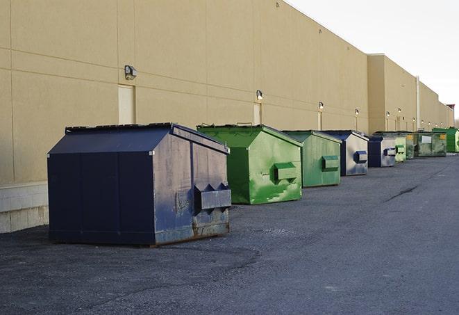 an assortment of sturdy and reliable waste containers near a construction area in Americus